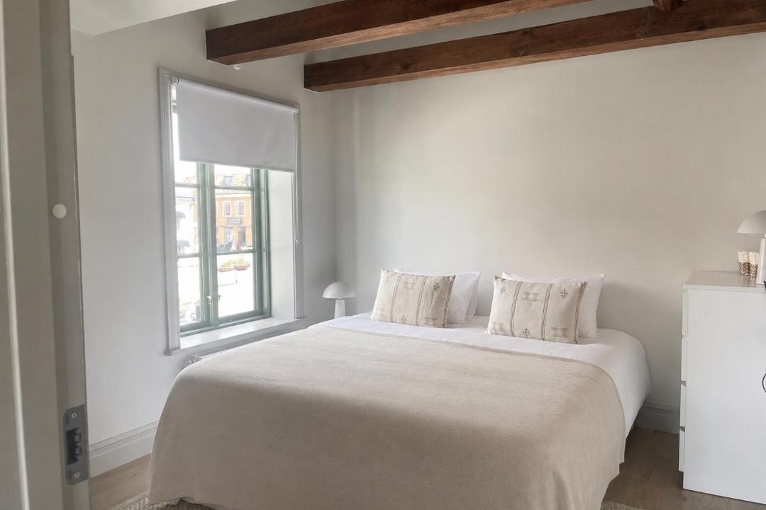 Innerstaden Apartment | Modern APT with Exposed Wooden Beams in Visby