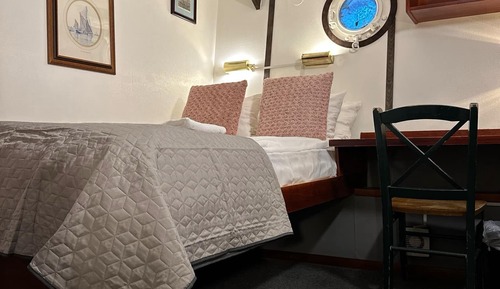 Classic double cabin on boat with shared bathroom