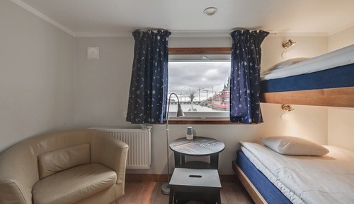 Economy double cabin on boat with seaview and shared bathroom