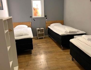 Triple Room with Shared Bathroom (No Windows)