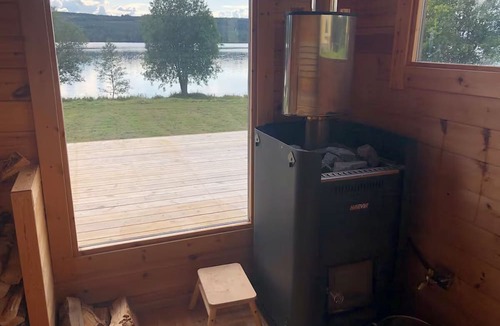 Ratan House | Lakefront house with a sauna, private dock, and rowboat
