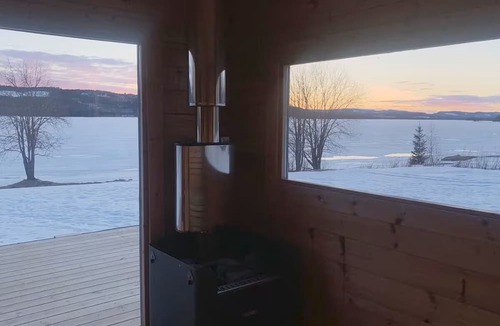 Ratan House | Lakefront house with a sauna, private dock, and rowboat