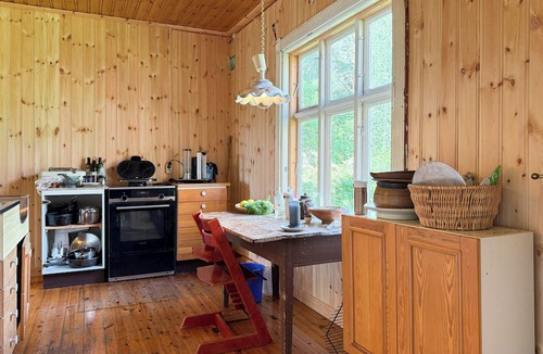 Drangedal House | 1770s farm with floating sauna by lake