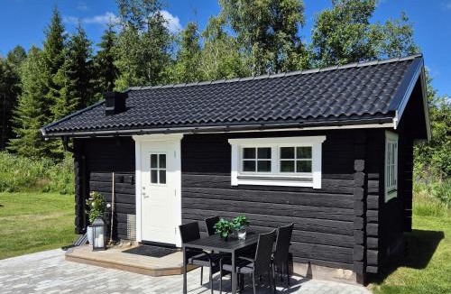 Leksand House | Mysig timmerstuga på dalagård