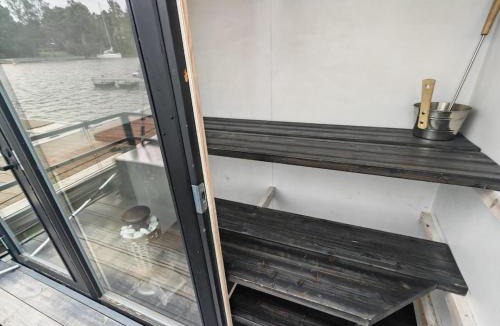 Kaakkoinen District Boat Rental | 2ndhomes Houseboat with Sauna & Terrace in Mustikkamaa