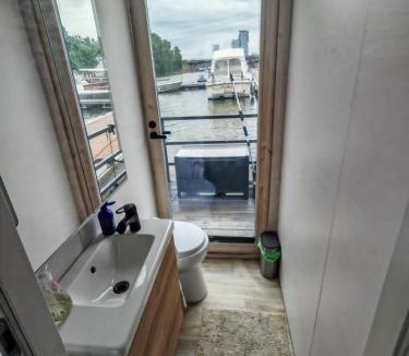 Kaakkoinen District Boat Rental | 2ndhomes Houseboat with Sauna & Terrace in Mustikkamaa