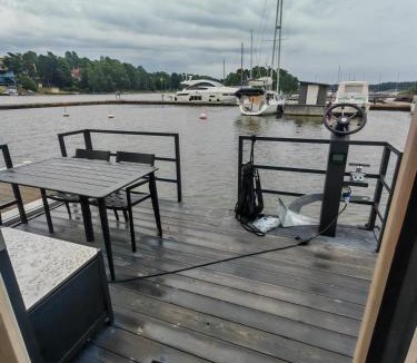 Kaakkoinen District Boat Rental | 2ndhomes Houseboat with Sauna & Terrace in Mustikkamaa