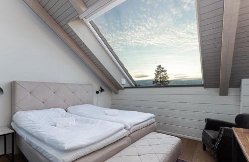 Ahtari House | Naava Chalet 401 Penthouse - Järvinäköala ilta-aurinkoon