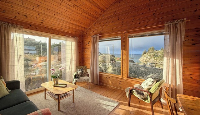 Cabin on hilltop with beach and sea views
